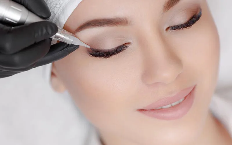 Semi-permanent eyeliner being applied — Brows By Liz studio
